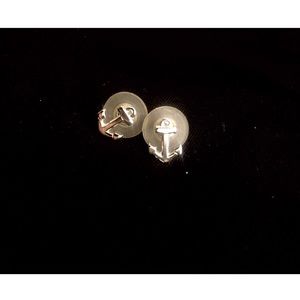 Nautical silver anchor earrings.